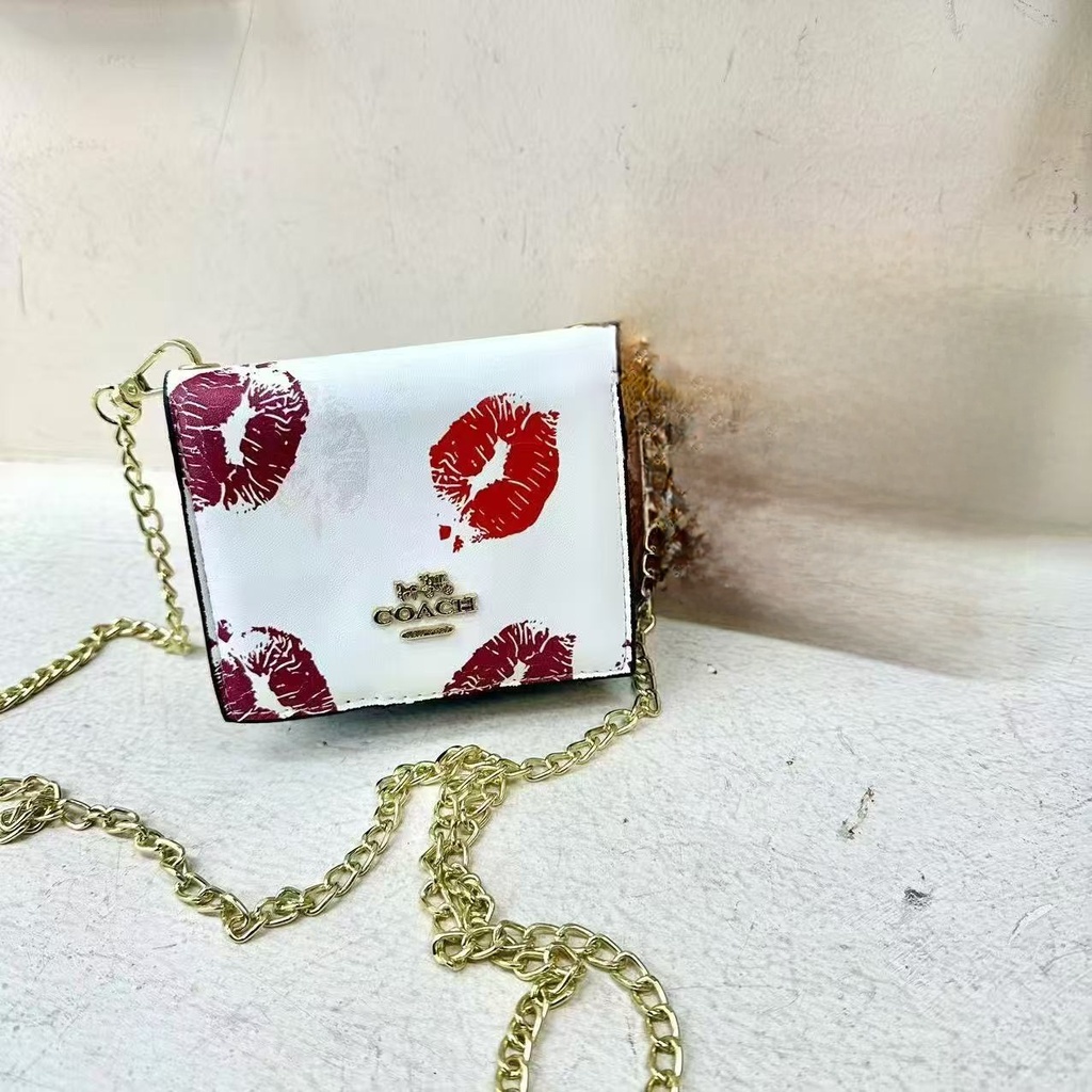 Billetera Cruzada Coach BESOS