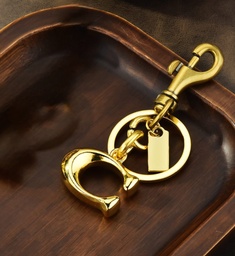 [3664210175] Llavero Coach Letra